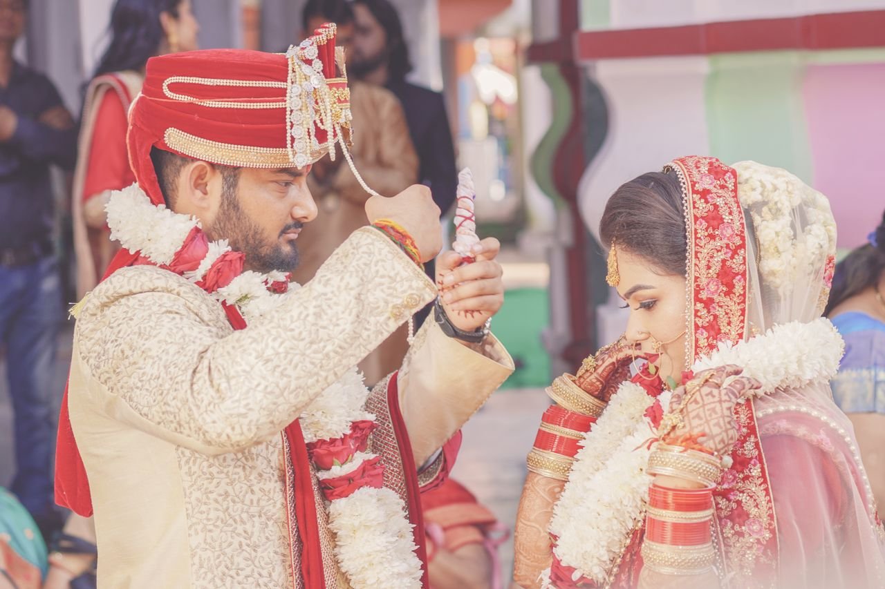 A beautiful Indian couple at their wedding ceremony, showcasing love and tradition in Dehradun.